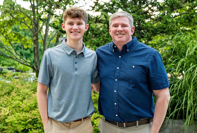 Photo showing a closeup of Brendon Paradis and his son Keegan standing next to each other